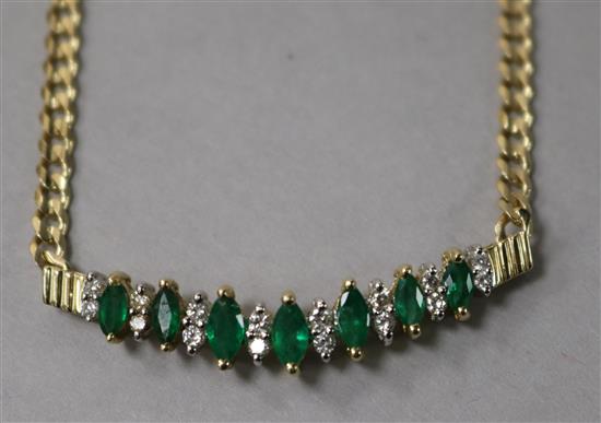 A 14ct gold, diamond and emerald set chevron shaped pendant, on a 14ct gold curb link chain, approx. 39cm.